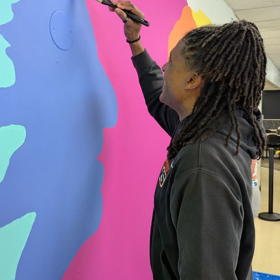 B Martin painting the mural