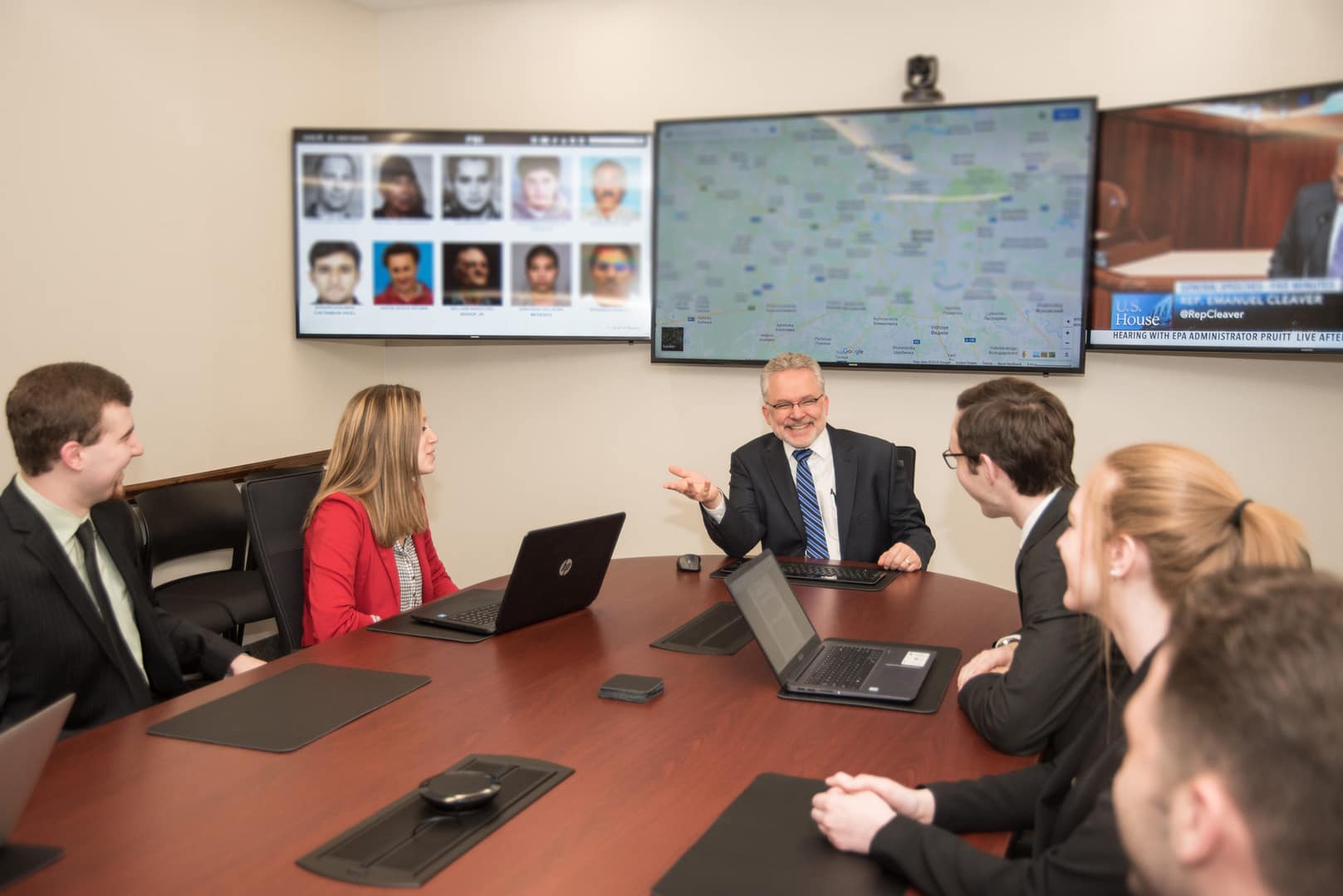 national security scholarship a male professor talks to five students in the situation room