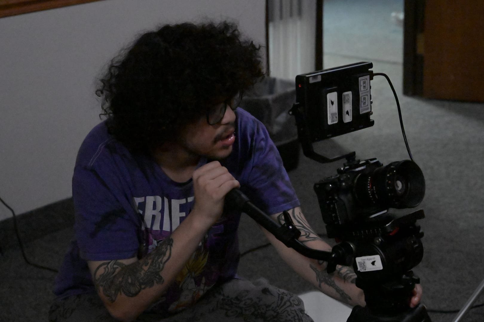 Aden shoots his music video. 