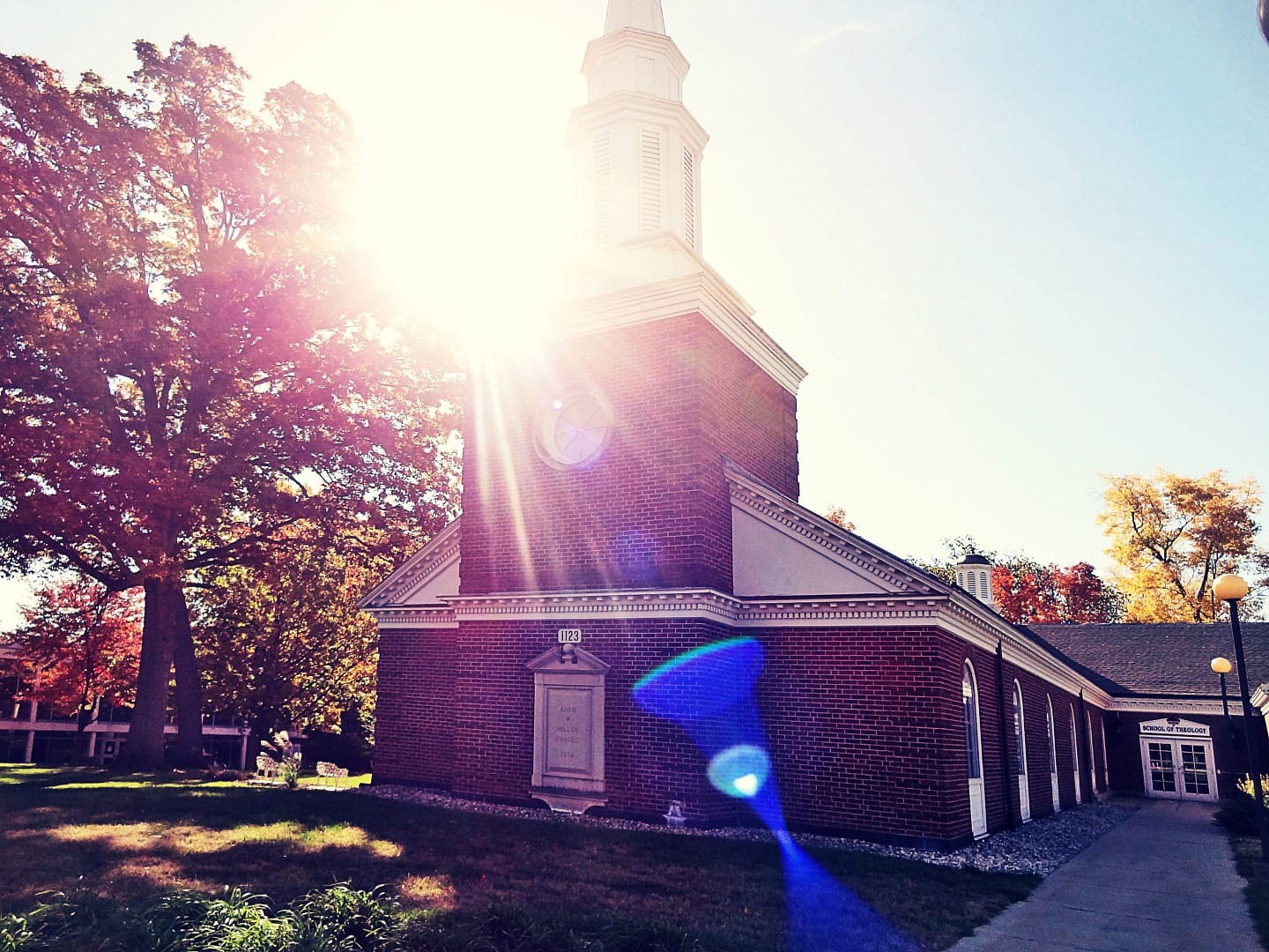 miller chapel with a sunburst near the steeple