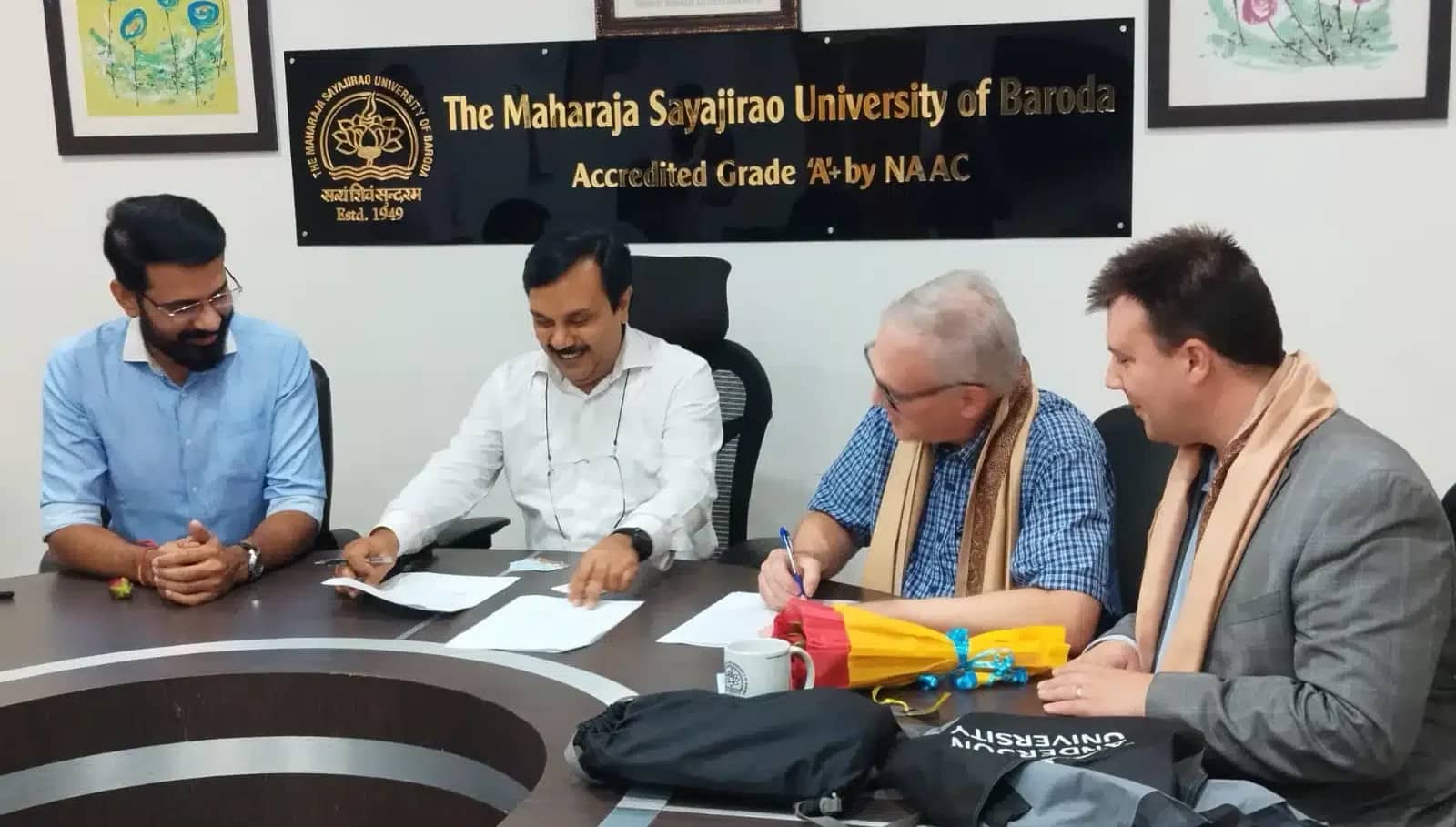 Dr. Larry Linamen and Dr. Lonnie Leeper meeting with members of The Maharaja Sayajirao University.