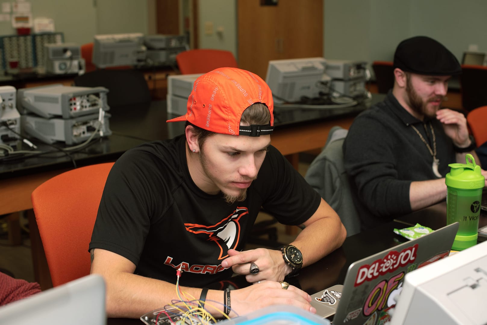 Student working intently on his computer in classroom