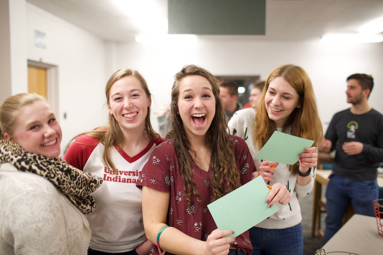 students with open mouths looking at papers