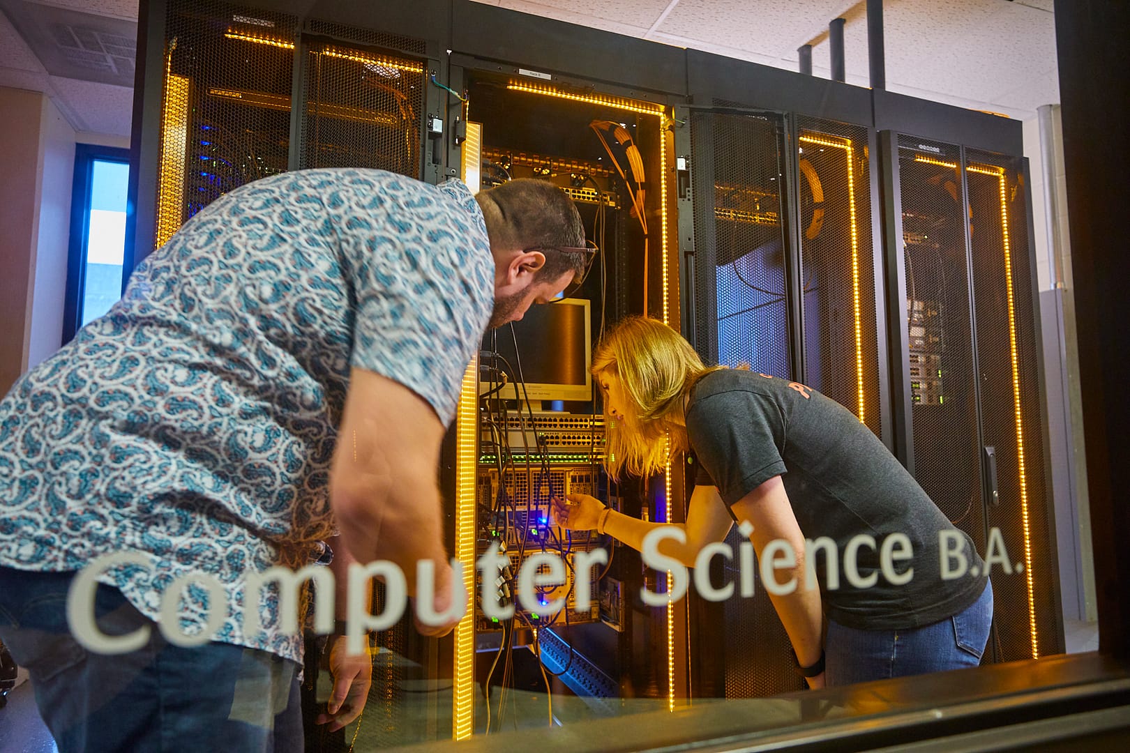 Two students examining a server