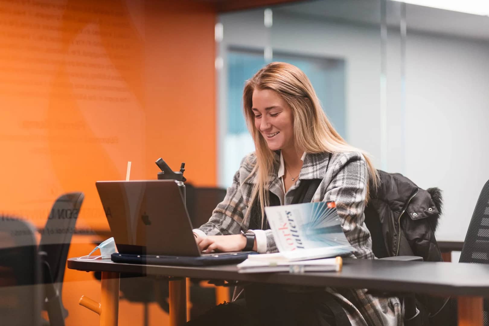 Student sitting at desk on computer