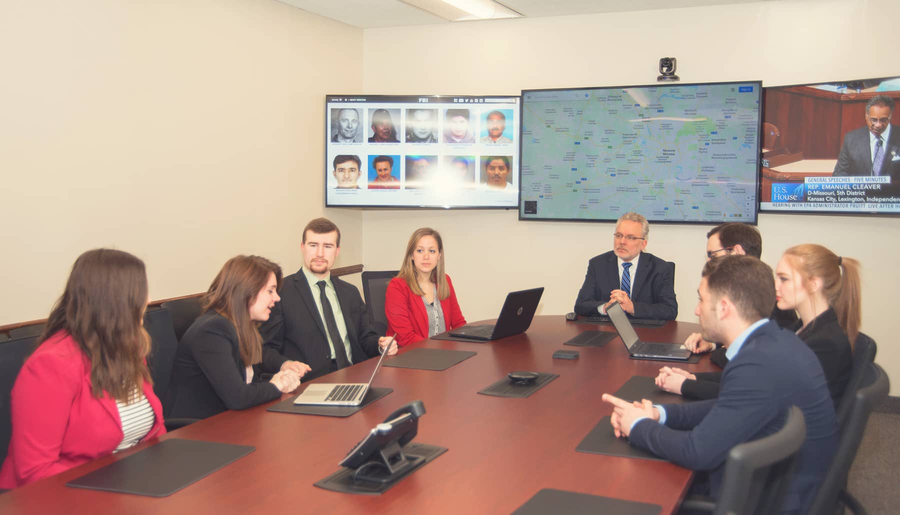 a group of students talk in the situation room