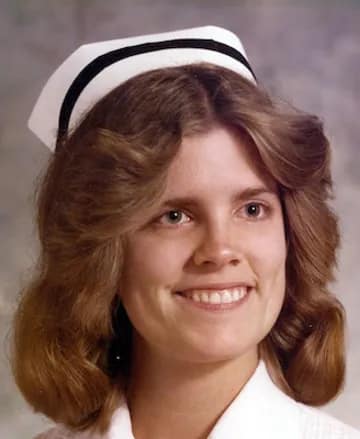 Karen "Michelle" poses in a nurse's cap.