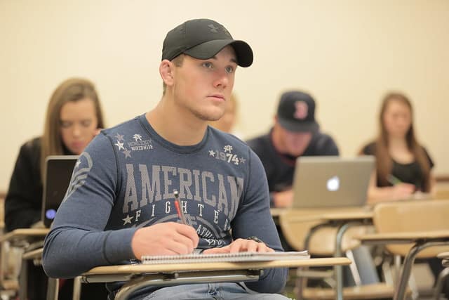 male student in class