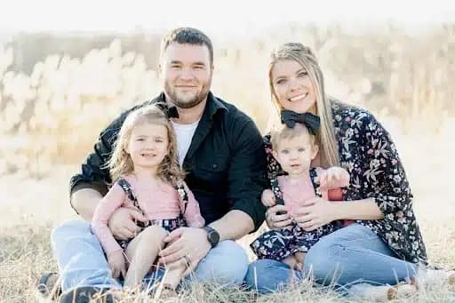 Hannah Burscott poses with her family. 